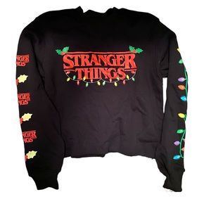 Stranger things Christmas sweater size medium.  Still has tags